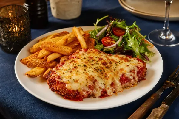 Crispy chicken parmigiana with chips and salad